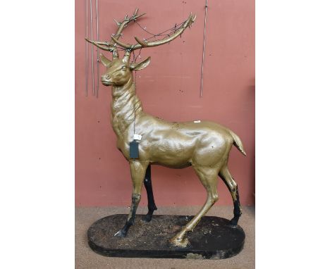 A gilt painted cast metal model of a stag, raised on oval black plinth base, height 160cm (af).Additional InformationWe can s