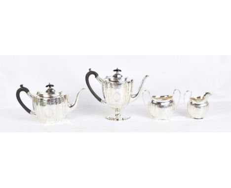 S BLACKENSEE &amp; SONS LTD; a George V hallmarked silver three piece tea service, with chased detail and panelled decoration