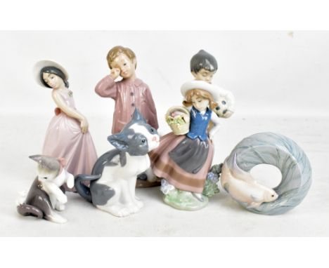 LLADRO; five figurines,&nbsp;to include&nbsp;'Iris', fish natural frames, etc, and two Nao figurines, each in box (7).Additio