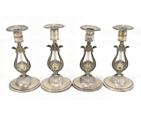 A set of four Swedish .830 silver candlesticks, each with circular sconce raised on lyre form support, height 17cm (part af) 