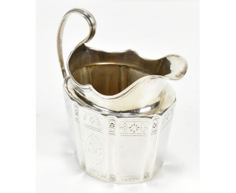 **AMENDED DESCRIPTION**An 18th century hallmarked silver cream jug, with panelled decoration and engraved foliate detail, wit