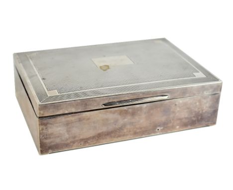 WILLIAM ADAMS LTD; a George V hallmarked silver rectangular engine turned cigarette box, inscribed to lid 'R.H.G.', Birmingha