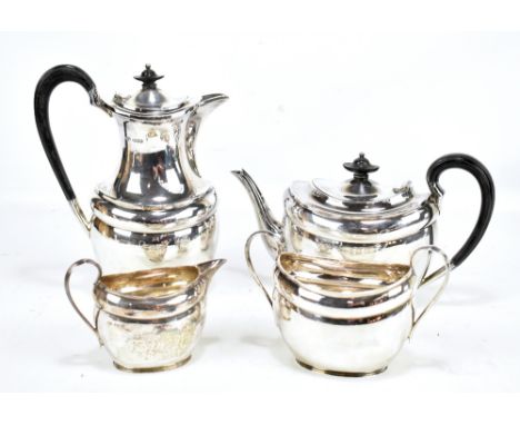 ATKIN BROS; a George V hallmarked silver four piece tea set comprising teapot, length 26.5cm, hot water pot, twin handled sug