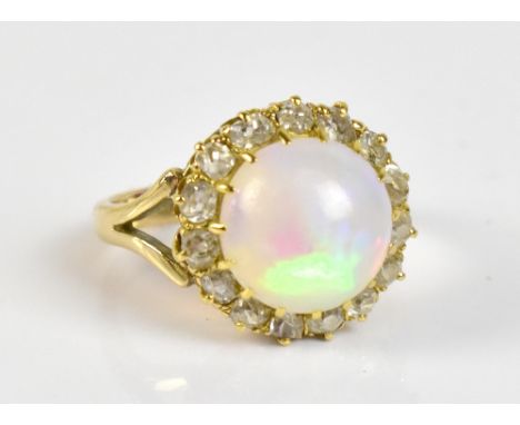 A 9ct yellow gold opal and diamond dress ring, size I, approx 4.2g.Additional InformationThere are no chips to the opal, ther