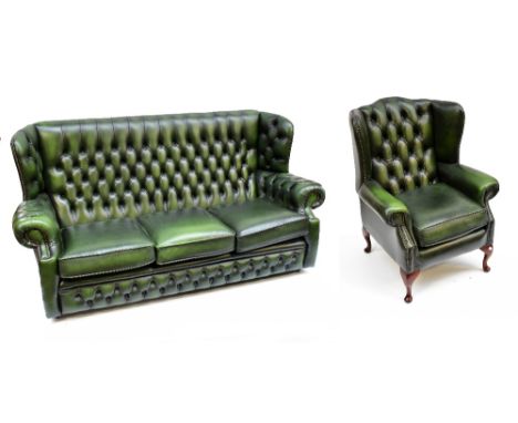 A green leather button upholstered wing back three seater settee with matching chair on cabriole legs and a red foot stool (3