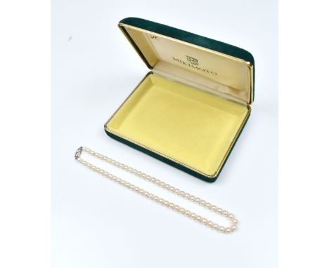 MIKIMOTO; a string of cultured pearls with silver clasp, length 42cm.Additional InformationDiameter 6mm.