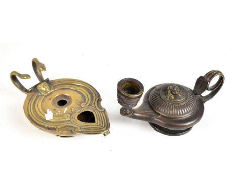 An early 19th century patent self lighting oil lamp based on a Roman original with twin serpent handles, length 17.5cm, and a