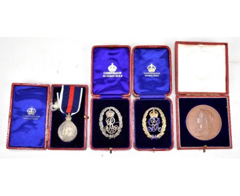 A 1902 Edward VII Coronation Medal and badge, both white metal, a Victorian Diamond Jubilee Medal and a George V gilt metal a