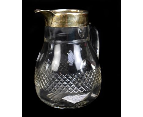 THE ALEXANDER CLARK MANUFACTURING CO; a clear cut glass water jug with Victorian hallmarked silver collar and spout, Birmingh