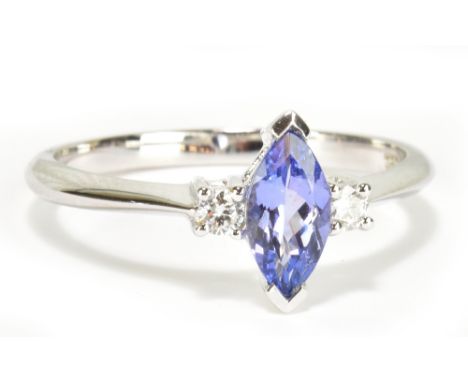 An 18ct white gold tanzanite and diamond three stone ring, size N, approx 2.5g.