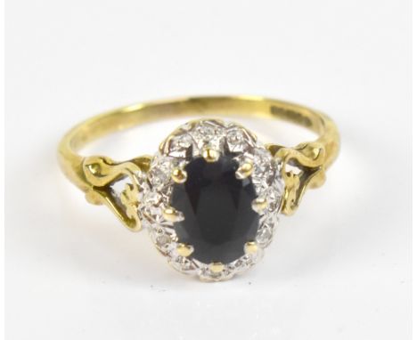 A 9ct yellow gold sapphire and diamond oval dress ring, size R , approx 2.9g.