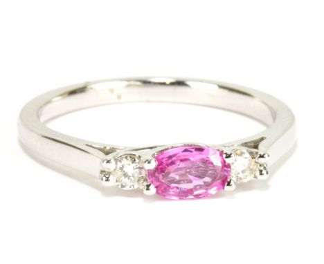 An 18ct white gold pink sapphire and diamond three stone ring, size O, approx 3.3g.