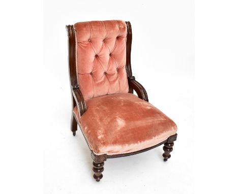 A Victorian mahogany framed button back nursing chair in pink upholstery, on turned front legs to castors.Additional Informat