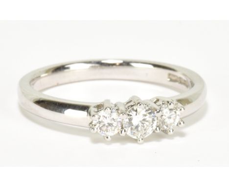 A 9ct white gold and diamond three stone ring, with total diamond weight approx 0.33cts, size L 1/2, approx 3g.