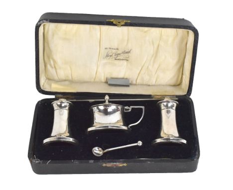 A cased George V hallmarked silver three piece cruet set with integral liners, Birmingham 1934, spoon associated.Additional I