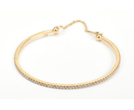MESSIKA OF PARIS; an 18ct yellow gold and diamond set child's/baby's bangle, approx 4.7g.Additional InformationDiameter is 5c