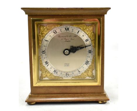 ELLIOTT OF LONDON; a giltwood mantel clock, the silvered chapter ring set with Arabic and Roman numerals and inscribed 'Garra