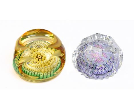 WHITEFRIARS; two faceted glass paperweight, each with Millefiori decoration, each signed with Monk to cane and dated 1976 and