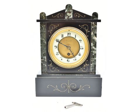 SAVAGE OF PARIS; a late 19th century French black slate and marble mantel clock of architectural form, the enamelled chapter 