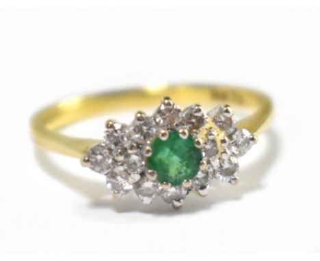 An 18ct yellow gold diamond and emerald and cluster ring, size L, approx 2.2g.