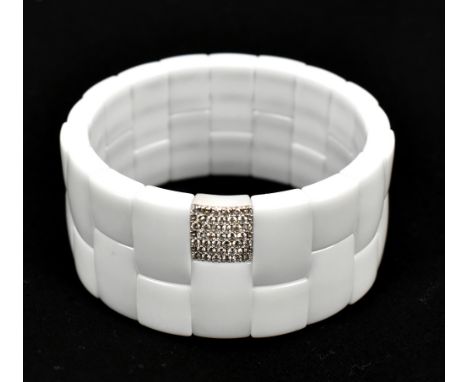 ROBERTO DEMEGLIO; a 'Domino' white ceramic and unmarked white gold diamond set expandable bracelet, width 2.75cm.Additional I