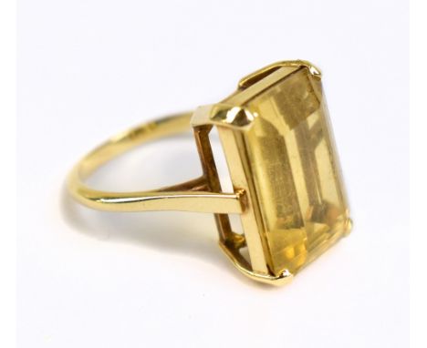 A yellow metal topaz dress ring, the inner band stamped 585, sold with original receipt from 1969, approx 5.1g, size L.