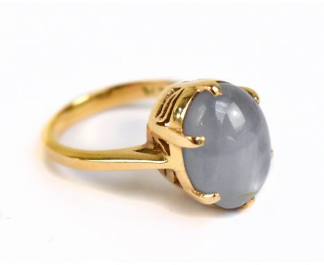 A yellow metal white star sapphire dress ring, approx 7.1g, size M.