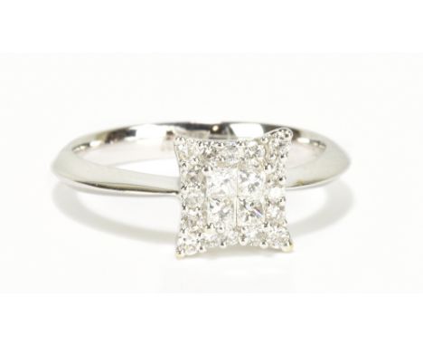 An 18ct white gold diamond ring with stepped platform set with twenty diamonds totalling approx 0.34cts, size L, approx 3.2g.