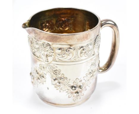 WAKELY &amp; WHEELER; a Victorian hallmarked silver cream jug with repoussé mask and floral swag decoration, London 1887, hei