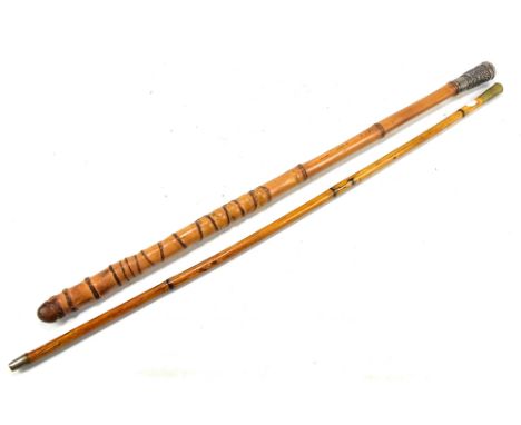 A Chinese bamboo swagger stick with white metal ferrule, with cast decoration depicting a four claw dragon, length 66cm, also