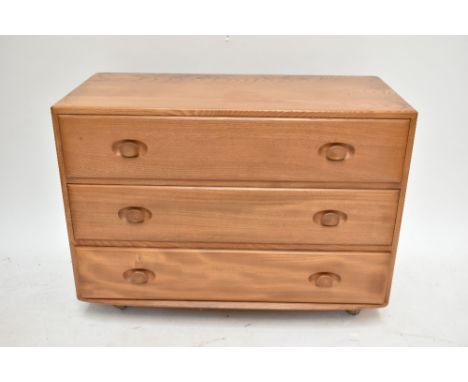 ERCOL; a light elm three drawer chest of drawers, width 91cm.