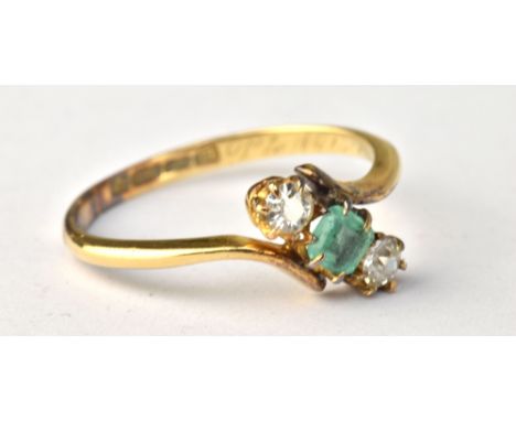 An 18ct yellow gold diamond and emerald three stone ring, the diamond approx 0.10cts, the band indistinctly engraved 'Ptom 15