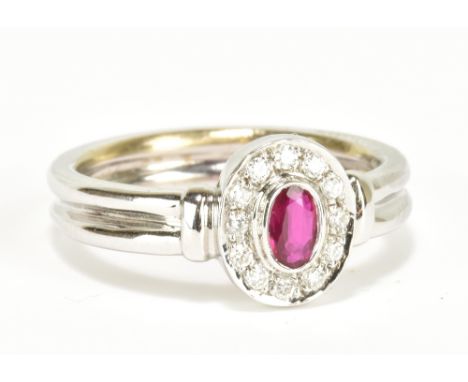 An 18ct white gold ruby and diamond ring, size M, approx 5.3g.