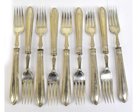JOHN ALDWINCKLE &amp; THOMAS SLATER; a set of nine Victorian hallmarked silver bladed and silver sheath handled forks, London