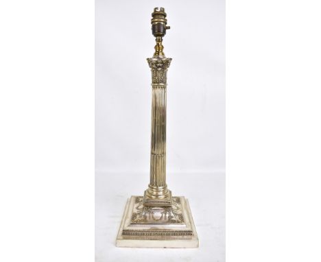 A late 19th century electroplated Corinthian column table lamp converted to electricity, with relief floral swag detail, lack