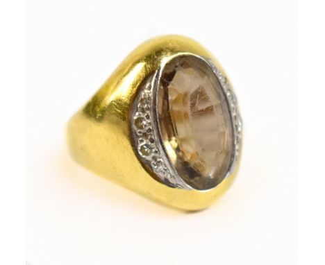 A yellow metal citrine and diamond dress ring, the inner band stamped 750, approx 8g, size J.