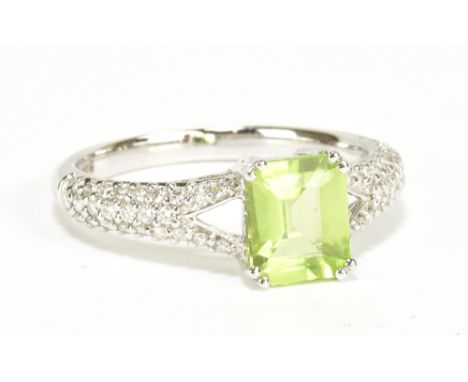 An 18ct white gold green peridot and diamond dress ring, size L, approx 2.8g.