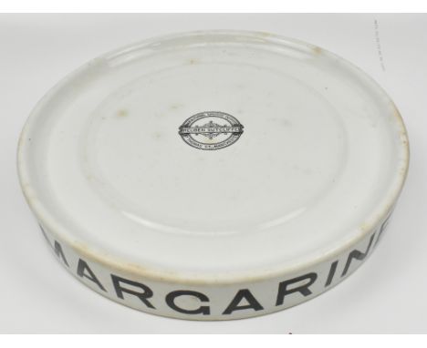 REUBEN SUTCLIFFE OF 57 THOMAS ST, MANCHESTER; an original iron stone butchers margarine slab of circular form, diameter 41cm.
