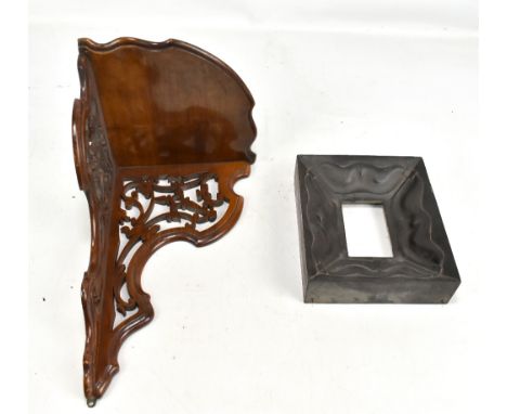 A deeply carved rectangular picture frame, 22 x 19cm, and a walnut corner wall bracket (2).&nbsp;