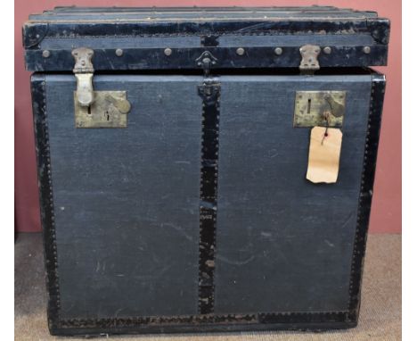 A wooden bound storage trunk with London retailer's label to the interior.