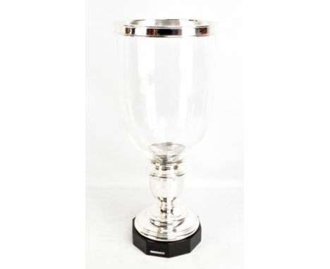 RALPH LAUREN; a large contemporary clear glass and silvered metal vase/candle holder with interior spike and ebonised plinth,