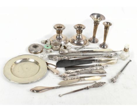 A group of variously hallmarked silver and silver handled items including a pair of vases on loaded base, numerous button hoo