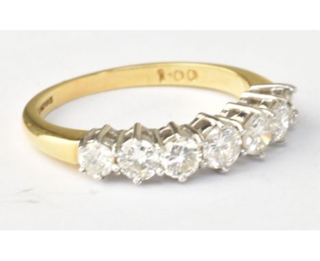 An 18ct yellow gold seven stone graduated diamond ring, diamond weight totalling 1ct, size N 1/2, approx 3.4g.Additional Info