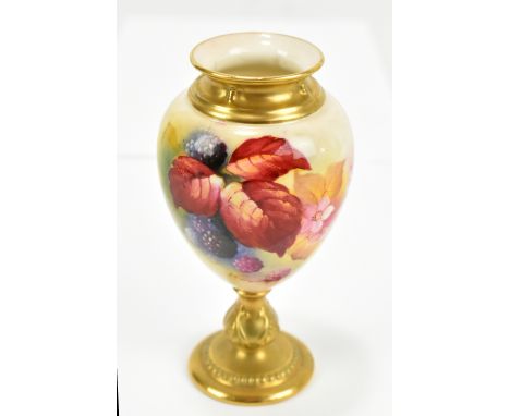 KITTY BLAKE FOR ROYAL WORCESTER; a hand painted pedestal vase, painted with fruits and flowers, signed to rim and puce factor