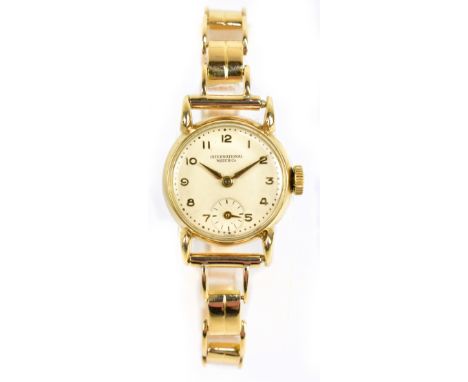 INTERNATIONAL WATCH CO (IWC); a lady's 14ct yellow gold wristwatch, the circular dial set with Arabic numerals and subsidiary