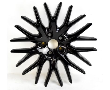 YNGVE HOLEN (Norwegian); an alloy car wheel wall sculpture, 'Leichtmetallrader', produced by using a 5-axis water jet, diamet