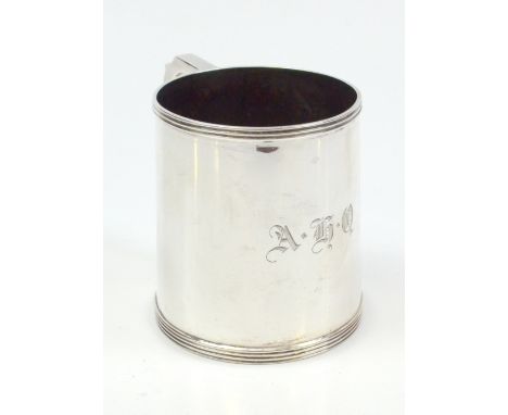 OLDFIELD LTD; a George V hallmarked silver mug with reeded detail and C-scroll handle, initialled 'A.H.Q', Birmingham 1913, h