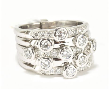 An 18ct white gold and diamond set six section ring with nine principal stones, size M 1/2, approx 14.8g.Additional Informati