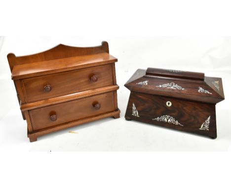 A Victorian rosewood and mother of pearl inlaid tea caddy of sarcophagus form, with two internal canisters on compressed bun 