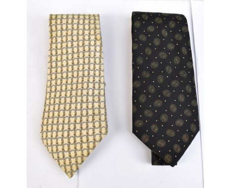 HERMÉS; a cream and silver link and hoop silk tie, and black and cream patterned silk tie.